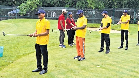 Visually-impaired participants try their hand at golf at KGA on Thursday.