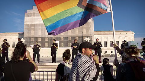 Demonstrators protest outside the US Supreme Court on Wednesday, Nov. 5, 2025, in Washington.