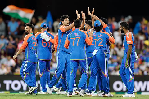 Shivam Dube (third from left) is congratulated by teammates after taking a wicket during a T20 cricket international between India and Australia in Carrara, Australia, Thursday, Nov. 6, 2025.