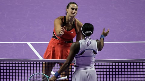 Aryna Sabalenka of Belarus, left, greets her opponent Coco Gauff of the United States after winning the women's singles match at the WTA tennis finals in Riyadh, Saudi Arabia, Thursday, Nov. 6, 2025.