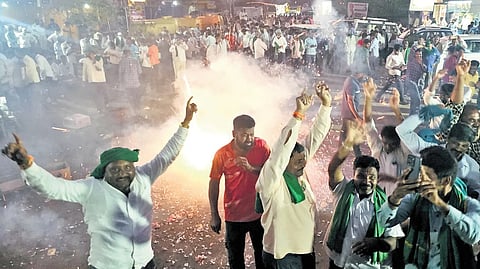 Farmers celebrate the state government’s revised price for sugarcane at Gurlapur Cross in Mudalagi in Belagavi district on Friday.