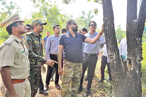 Deputy CM Pawan Kalyan examines a tree in the Mamandur forest