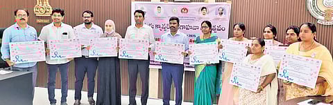 Specially designed invitation cards being unveiled for the NCD programme to encourage women to go for cancer screening test, in Vijayawada.