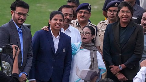 Richa Ghosh, member of the Women's ODI World Cup winning Indian cricket team, with West Bengal Chief Minister Mamata Banerjee, Cricket Association of Bengal (CAB) President Sourav Ganguly and former cricketer Jhulan Goswami during a felicitation ceremony in Kolkata. (Photo | PTI)