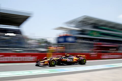 McLaren's British driver Lando Norris drives through the pit lane during the practice session of the Sao Paulo Formula One Grand Prix at the Jose Carlos Pace racetrack, aka Interlagos, in Sao Paulo, Brazil on November 7, 2025.
