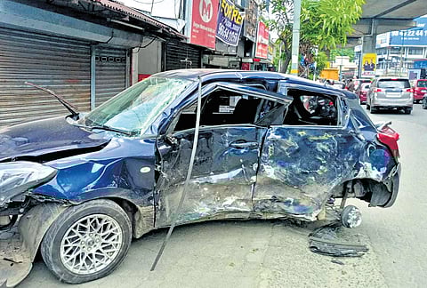 The mangled remains of the car that hit a metro pillar near Changampuzha Park