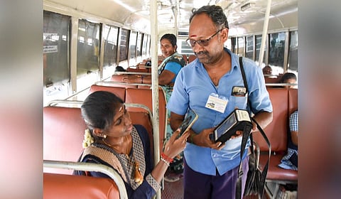 A passenger scanning the UPI code to pay for ticket on a TNSTC bus in Tiruchy.