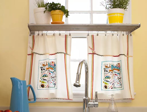 Cafe curtains (by Livspace) that can pull a whole room together by complementing the colours of other elements in the room