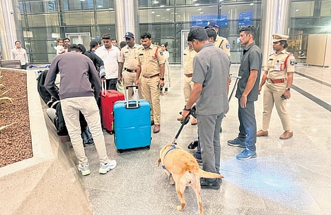 RGIA police, along with Bomb Detection Team (BD Team) and CISF personnel, conduct searches at the Rajiv Gandhi International Airport on Monday.