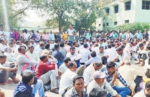 Farmers staging protest outside Bargarh collector’s officer on Monday.