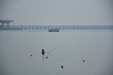 Smog engulfs the Adilabad lake on a winter morning on Tuesday.