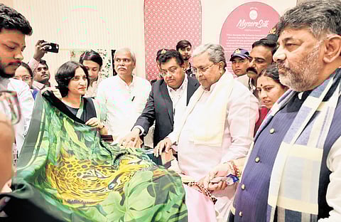 CM Siddaramaiah, DCM DK Shivakumar, and Industries Minister MB Patil at the inauguration of the new Kalaloka store at Terminal 2 of KIA on Tuesday.