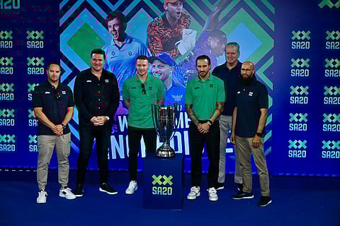 From (L) SA20 ambassador Mark Boucher, SA20 commissioner Graeme Smith, Paarl Royals captain David Miller, Jo'burg Super Kings captain Faf du Plessis, LSG Global Director of Cricket Tom Moody, MI Cape Town head coach Hashim Amla pose with the SA20 trophy at the SA20 India event in Mumbai on Wednesday