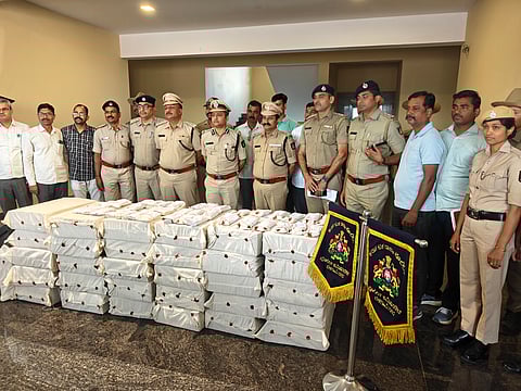 Belagavi police commissioner Bhushan Borse and his officials with the seized laptops from the Call Centre in Belagavi.