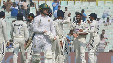 India's Jasprit Bumrah (2nd from right) celebrates a wicket with teammates against South Africa on Day 1 of the first Test in Kolkata on Friday