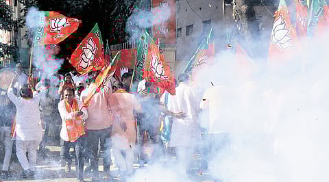 BJP party members celebrate the NDAs victory in Bihar Elections at the state party office in Nampally, Hyderabad on Friday.