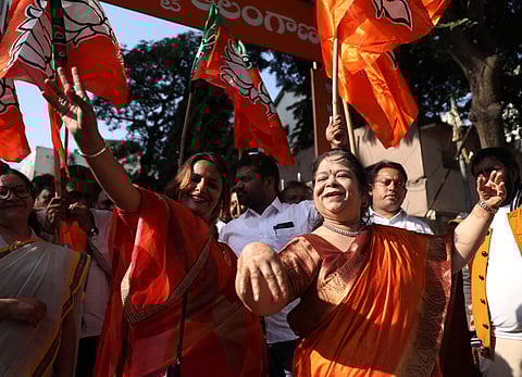 BJP party members celebrate the NDA's victory in the Bihar Elections at Patna