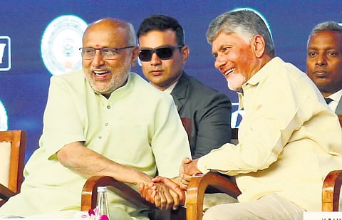 Vice President CP Radhakrishnan and Chief Minister N Chandrababu Naidu share a light moment at the Partnership Summit in Vizag on Friday