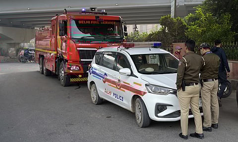 Delhi Police and fire officials at the spot where explosion sound near Mahipalpur turns out to be tyre burst in New Delhi on Thursday,