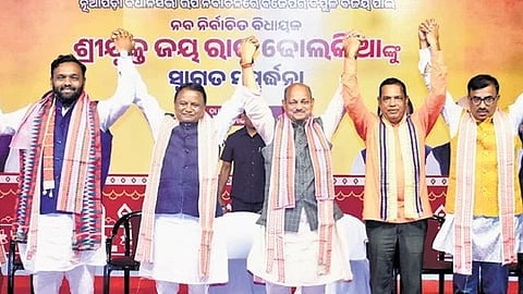 CM Mohan Majhi, state BJP president Manmohan Samal with newly-elected MLA Jay Dholakia at the felicitation ceremony in Bhubaneswar.