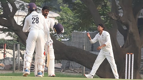 Tamil Nadu's C Andre Siddarth (L) and Baba Indrajith (C) in action on Day 1 in Coimbatore