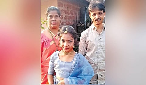 Vijaya with his wife, Kushala and their daughter Trisha.