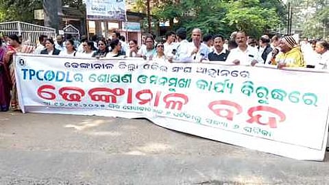 Agitators taking out the protest march in Dhenkanal town on Monday