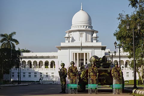 Bangladeshi Army soldiers stand guard outside the Supreme Court after security has been beefed up across the country ahead of an expected verdict against ousted Prime Minister Sheikh Hasina, in Dhaka, Bangladesh, Monday, Nov. 17, 2025.