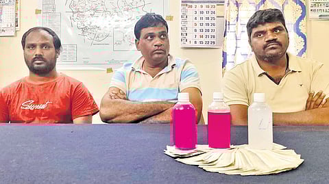 Civil Supplies deputy tahsildar Yakub Pasha and two others detained, with the seized Rs 30,000 bribe amount on display after the ACB trap in Yellandu on Monday.