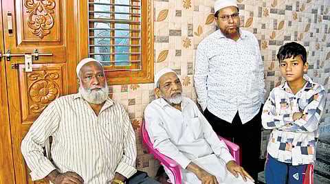 Mourners at the residence of Mohammed Ali in Jhirra; people gathered outside the house of victims in Asifnagar.