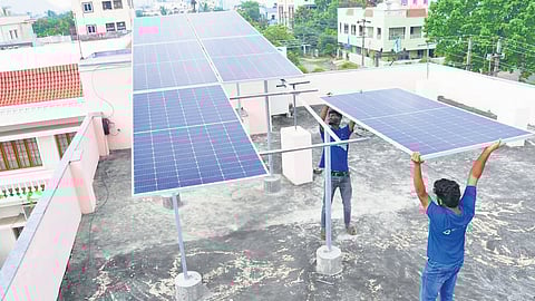 A rooftop solar plant being installed on an apartment in Visakhapatnam.