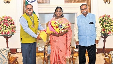 President Droupadi Murmu with NMA chairman Kishor Basa and Ashok Basa