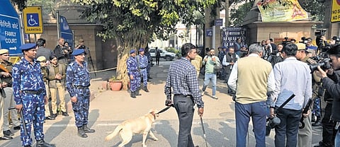 Rapid Action Force (RAF) and Delhi police dog squad outside the Patiala House Court that received a hoax bomb threat, in New Delhi on Tuesday