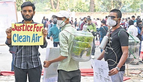 Citizens shout slogans during a protest against what they called the governments lack of action to combat air pollution in the capital city New Delhi on Tuesday, Nov. 18, 2025
