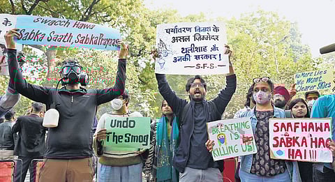 Residents stage a protest at Jantar Mantar on Tuesday criticising government for not tackling pollution crisis