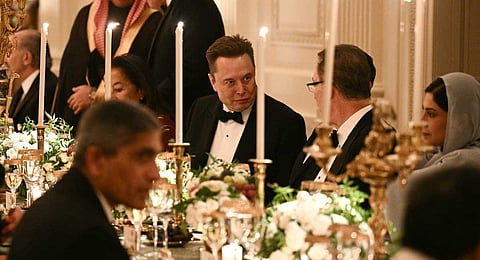 Elon Musk, CEO of SpaceX and Tesla, attends an official dinner with US President Donald Trump and Crown Prince and Prime Minister of the Kingdom of Saudi Arabia Mohammed bin Salman in the East Room of the White House in Washington, DC on November 18, 2025.