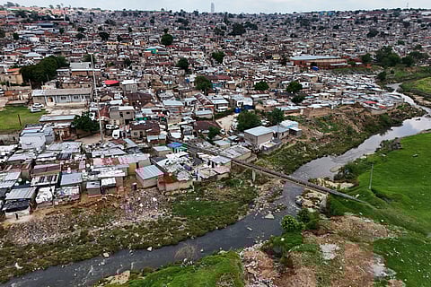 An aerial view of the Jukskei River in the Alexandra township in Johannesburg, South Africa, Wednesday, Nov. 12, 2025.