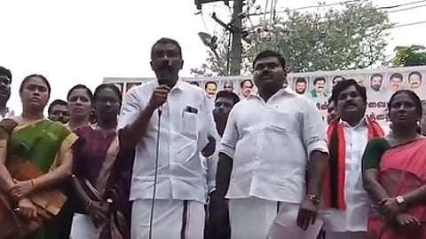 DMK Tenkasi South District Secretary V Jeyabalan addressing crowd in a protest.