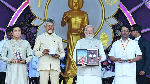 To mark the occasion, Mr Modi released a Rs 100 commemorative coin and jointly unveiled special postal stamps with Andhra Pradesh Chief Minister N. Chandrababu Naidu.