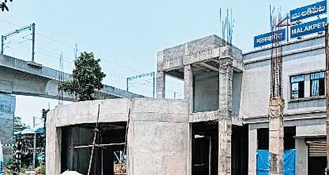 The commercial complex has had its terrace slab completed, and brickwork for the ground floor and the modified booking office on the first floor is done.
