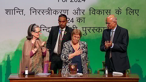 Congress leader Sonia Gandhi, left, presents the "Indira Gandhi Prize for Peace, Disarmament and Development for 2024" to former Chilean president Michelle Bachelet, center, at Jawahar Bhawan, in New Delhi.
