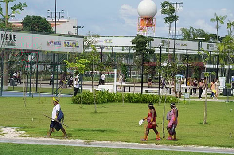 Indigenous peoples walk outside the venue for the COP30 U.N. Climate Summit, Thursday, Nov. 20, 2025, in Belem, Brazil.