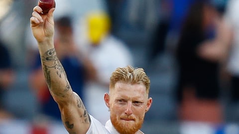 England's captain Ben Stokes raises the ball after taking five wickets during the first Ashes Test between Australia and England in Perth. (Photo | AP)