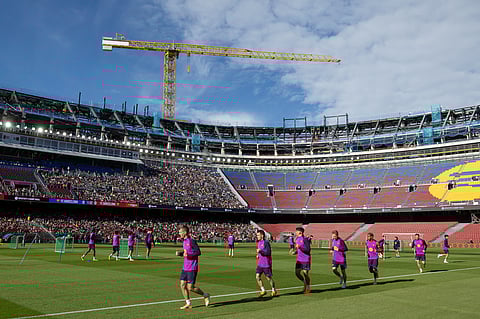 Barcelona players take part in an open training session, the first at the Camp Nou stadium since the beginning of the construction works more than two years ago, on November 7, 2025 in Barcelona.