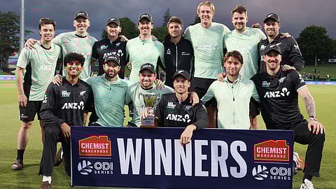 New Zealand players pose after winning the series following the third one-day international cricket match between New Zealand and West Indies played at Seddon Park in Hamilton on November 22, 2025.