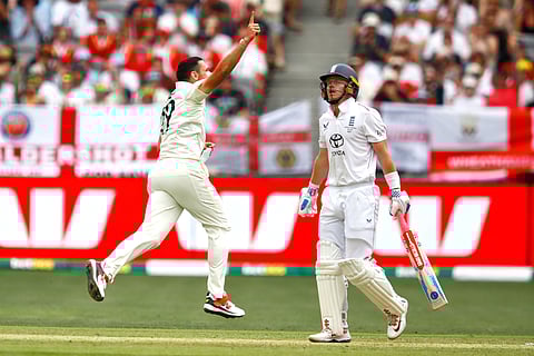 Australia's Scott Boland, left, celebrates the wicket of England's Ollie Pope on day two of the first Ashes cricket test match between Australia and England in Perth, Saturday, Nov. 22, 2025
