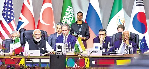 Prime Minister Narendra Modi attends a plenary session on the opening day of the G20 Summit at the Nasrec Expo Centre, in Johannesburg, South Africa, Saturday, Nov. 22, 2025.