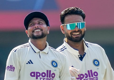 India's captain Rishabh Pant with teammate Kuldeep Yadav during the first day of the second Test cricket match between India and South Africa, at ACA Stadium, Barsapara in Guwahati, Saturday, Nov. 22, 2025.