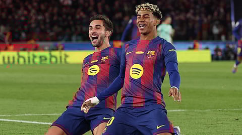 Barcelona's Ferran Torres celebrates with Lamine Yamal (R) scoring his team's fourth goal during the Spanish league football match between FC Barcelona and Athletic Club Bilbao at Camp Nou Stadium in Barcelona on November 22, 2025.