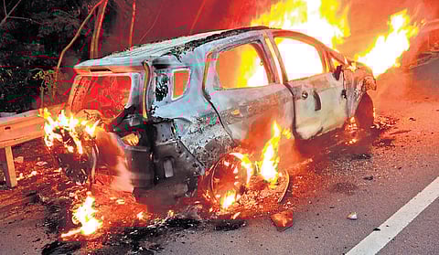 A car that caught fire with the driver trapped inside on the ORR near Shamirpet
on Monday